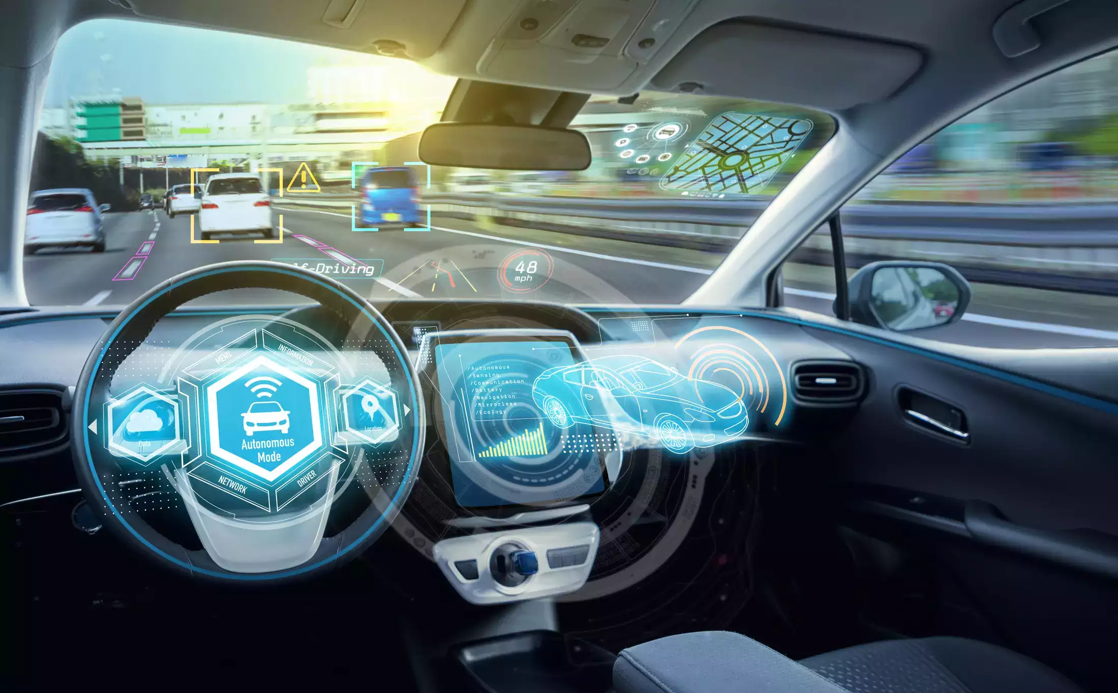 View from inside a car driving on a highway, showing digital interfaces and holographic displays for autonomous driving, navigation, and vehicle status, with cars visible on the road ahead through the windshield.